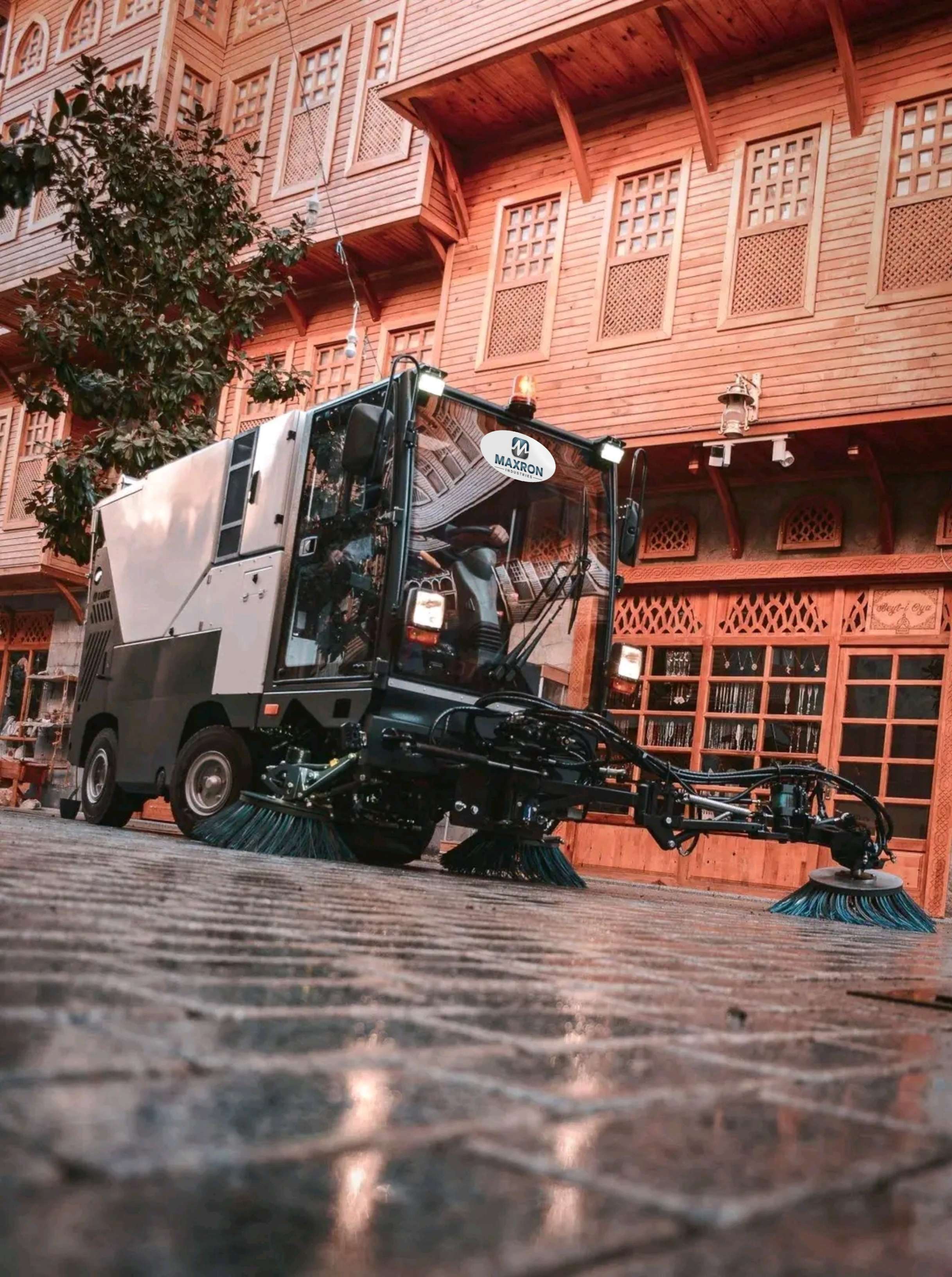 Maxron autonomous floor scrubber in cinematic studio lighting for industrial cleaning